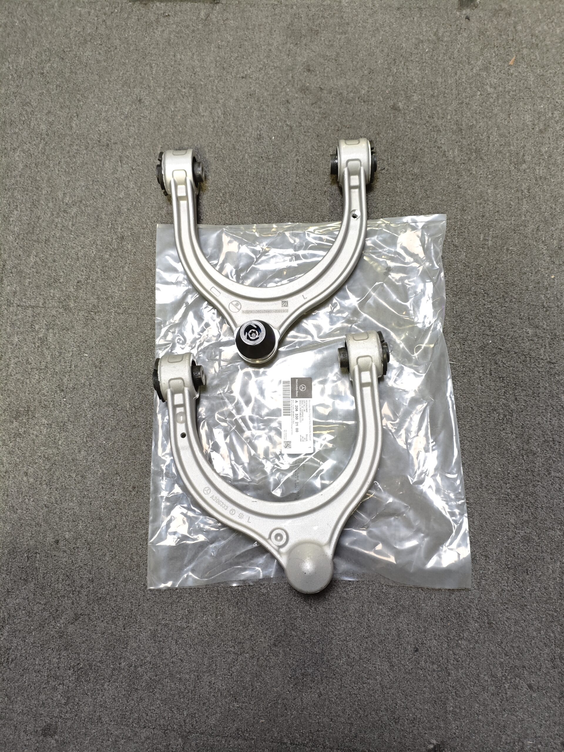 a6260b59e39f49cdeec8c450694aaf0 A2063302100 A2063302200 Mercedes-Benz W206 S206 Control Arm Front Axle, Left & Right 2063302100 2063302200 - Image 1